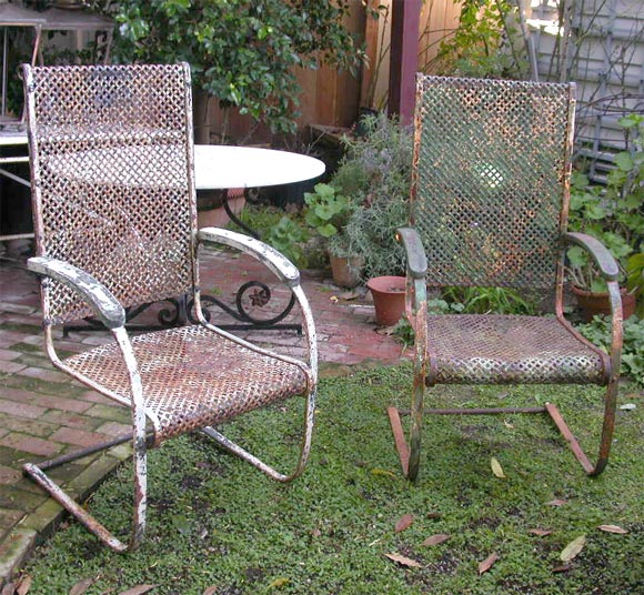 Pair of woven iron & spring steel chairs. Very high backs and  very comfortable because of the 