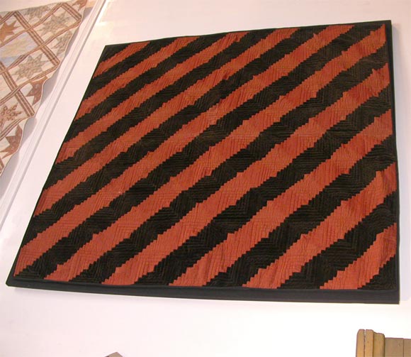 19TH CENTURY WOOL AND VELVET MOUNTED LOG CABIN QUILT