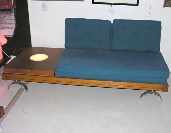 Loveseat with attached end table with internal lamp.