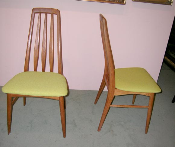 Set of four Danish Modern dining room chairs in polished teak wood, having tall backs and  pale green wool seats
by Danish designer Nils Kofoed.