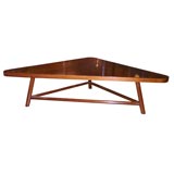 triangular walnut low table by T.H. RobbsJohn Gibbings