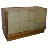 Sycamore and parchment two door cabinet by Jacques ADNET