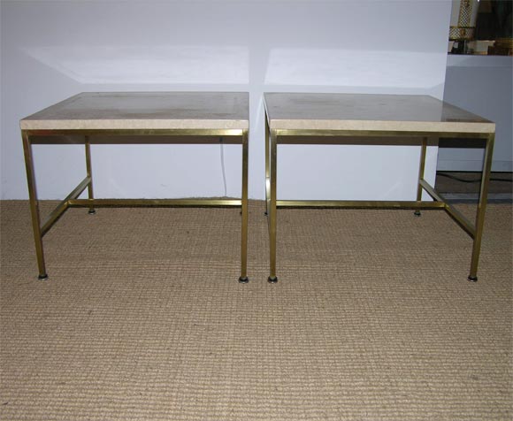 A pair of square brass tube frame occasional tables with travertine stone tops, model no. 8732, by Paul McCobb for Calvin Furniture. U.S.A., circa 1950.