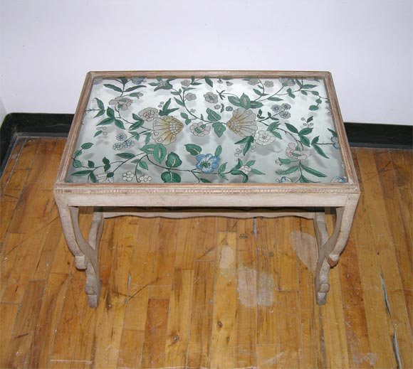 A rare and beautiful pair of eglomise (painted mirror) end tables by Jansen from 1935.