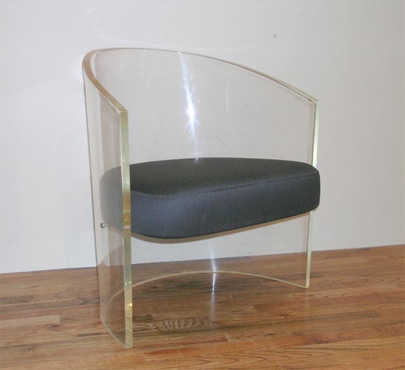 Barrel-shaped lucite chair probably manufactured by Pace, c.<br />
1970.  Heavy 3/4 inch lucite with newly upholstered fabric seat.