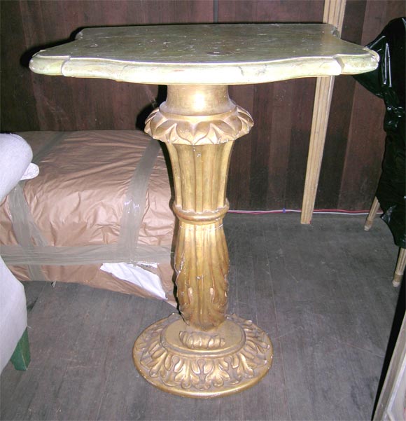 Italian carved wood gilt pedestal console with green faux marble wood top.