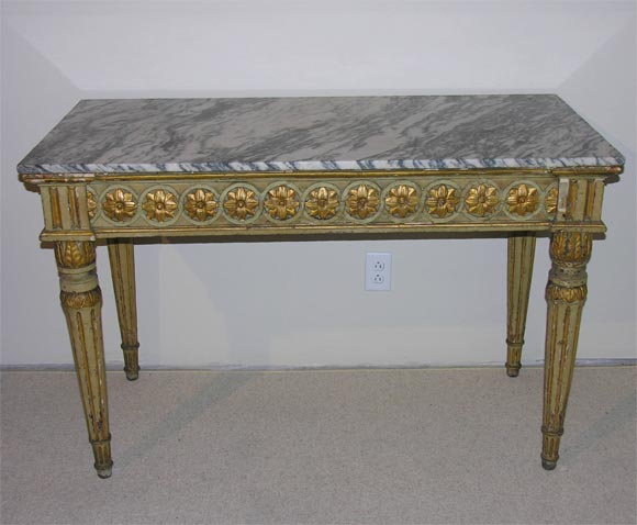Intricately carved and detailed Italian console.  Original greenish grey paint and parcel gilt.  Grey & white striated marble top, possibly original.