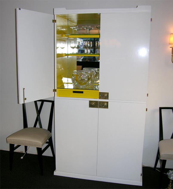 Tall White Lacquered Bar with Yellow Interior and Brass Hardware.