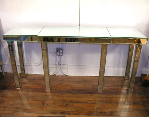 An exceptional engraved mirrored console by Marc Du Plantier, French, circa 1939.<br />
Documentation: MARC DU PLANTIER, 1901-1975 Les Decorateurs Des Annees 40 Pg 180
