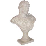 Stone bust of a woman in 18th century dress