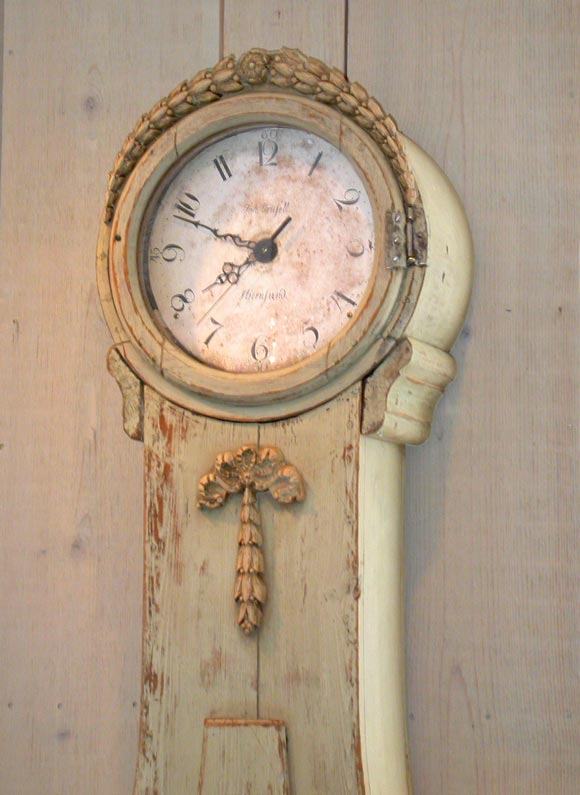 Green painted tall clock with seashell motif