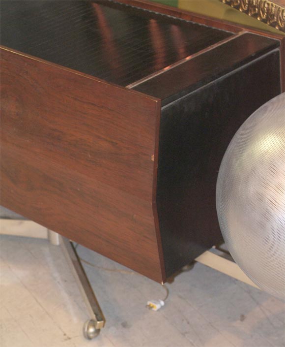 Skeletal aluminum frame suspends ball speakers.  Appeared on cover of an Oscar Peterson album from 1962.