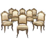 Sixteen Napolean III French walnut  parcel-gilt dining chairs