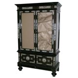 An intricately inlaid ivory and ebony Dutch display cabinet.