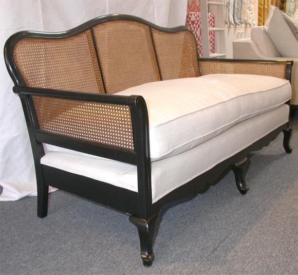 1930's Caned Settee with 19th century monogram cushion