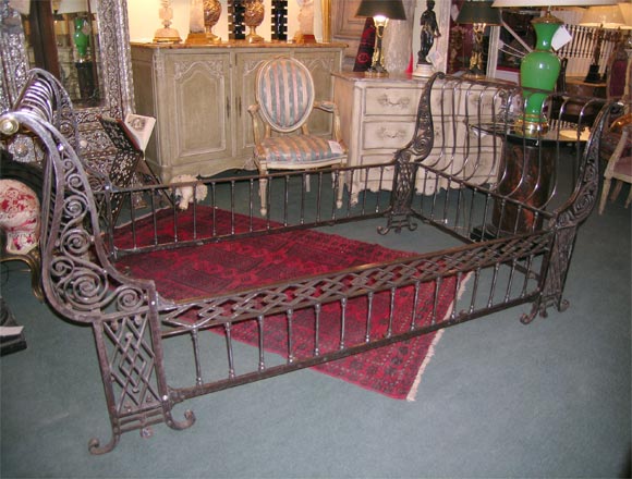 A FRENCH SIMI POLISHED IRON SLEIGH BED. ALL ORIGINAL HAND CRAFTED IN EXCELLENT CONDITION. COULD BE A OFFICERS CAMPAIGN BED, A LOT OF THESE TYPES WERE. INSIDE MEASUREMENTS OR MATTRESS SIZE 43