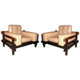 Pair of rosewood and leather chairs by Sergio Rodrigues