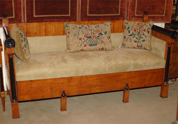 19th century Biedermeier sofa, Sweden, circa 1840. The frame in satin birch with ebonized accents. Upholstered in ultrasuede. The front base panel slides open to reveal a large storage drawer.