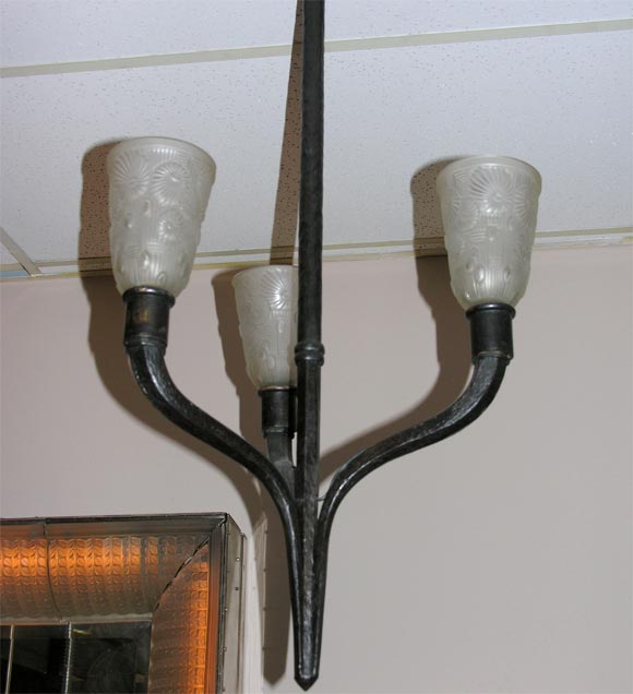 French wrought iron chandelier by Charles Piguet (signed.)