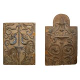 Two terracotta garden plaques.