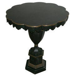A Black and Gold Tole Gueridon.