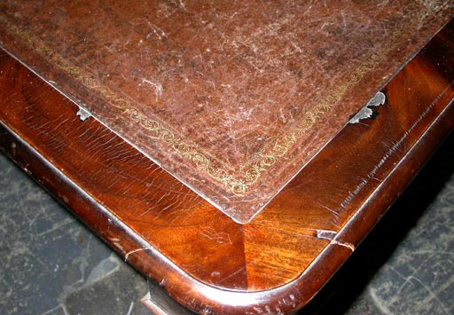 this grand board room table came from the board room of one of the nations largest banks.  It is of solid mahogany and mahogany veneers with an embossed leather inset and brass wheeled sabots. new reduced price!