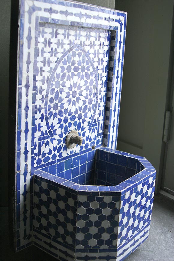 Handmade ceramic wall fountain from Morocco.  Easy to move as this piece is on rollers.  Could be used indoors as well as outdoors.