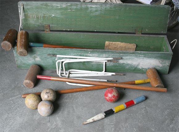 Croquet set with wooden storage box.  Original playing manuel included.