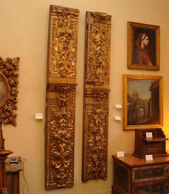Two baroque carved and gilded vertical panels