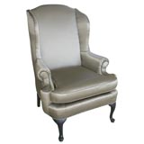 A  Decorative Satin Covered Wing Chair.