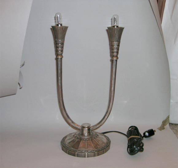 A pair of French Art Deco table lamps.

Signed 