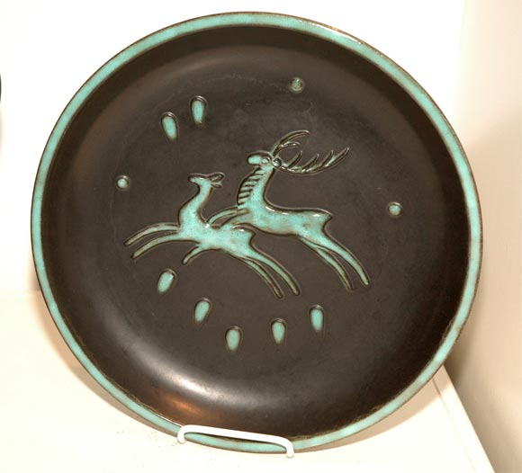 Matt and Glazed Black Background and Teal Motifs.<br />
The platter measures 14 inches wide .Base 9 inches. Height 2 inch.