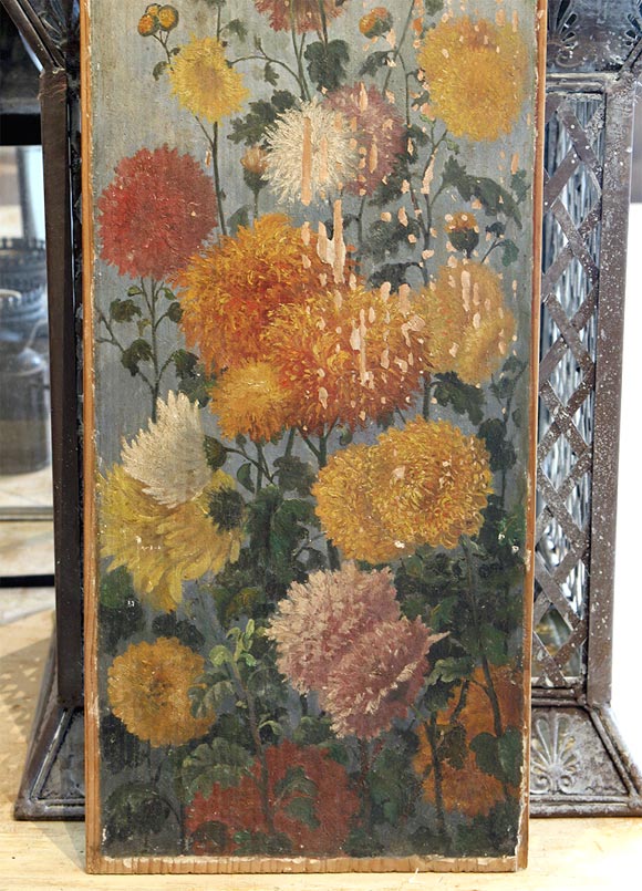A painted wood plaque, flower motif