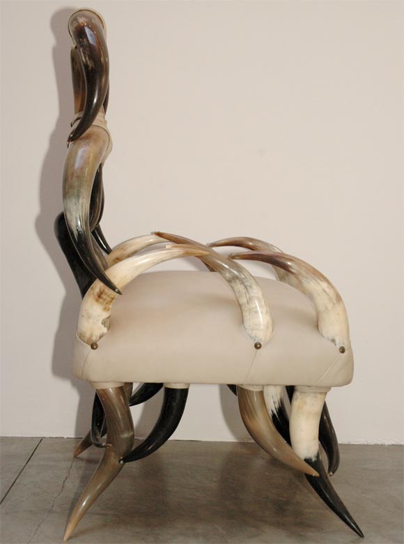 Horn and beige leather chair with otoman