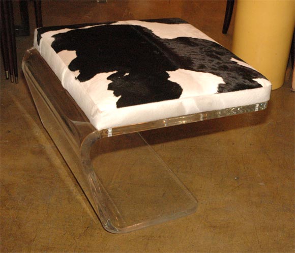 Large lucite and cow hide ottoman