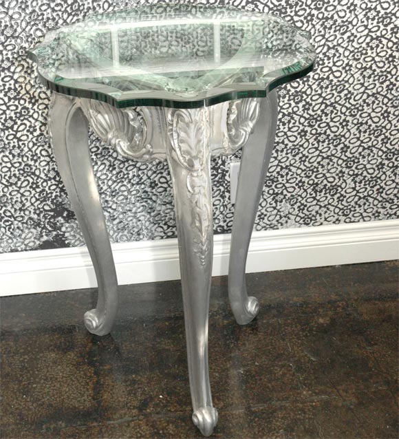 Stunning 100% recycled cast aluminum side tables in a classic Louis XIV motif with beveled annealed glass tops. Done in a royal scalloped style. Sold individually.