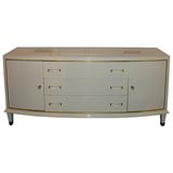 An ivory color lacquered sideboard by Jacques ADNET