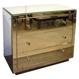A mirrord commode by Jacques ADNET