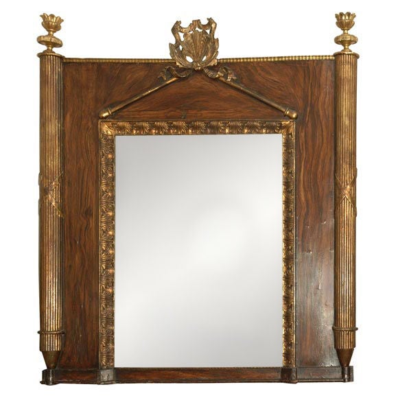 Carved giltwood and faux bois painted mirror from early 19th century France. Finial topped reeded columns and a ribbon shell crest over pediment.