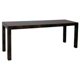 A Matched Burled Veneer Parsons Style Long Console. A Matched Burled Veneer Parsons Style Long Console.