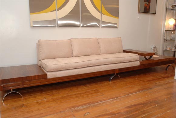 Paul Tuttle design architectural sofa on brushed aluminum arch legs, refinshed walnut with new ultra suede upholestery. Built in table lamp with moveable end table.
