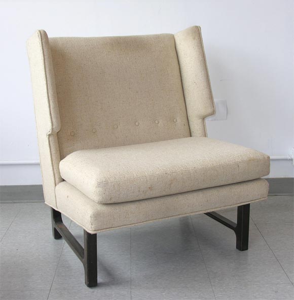 Harvey Probber lounge chair, with broad seat and wing back. Carved Mahogany frame, with oatmeal wool weave fabric. Should be reupholsered. Pair available, priced individually.