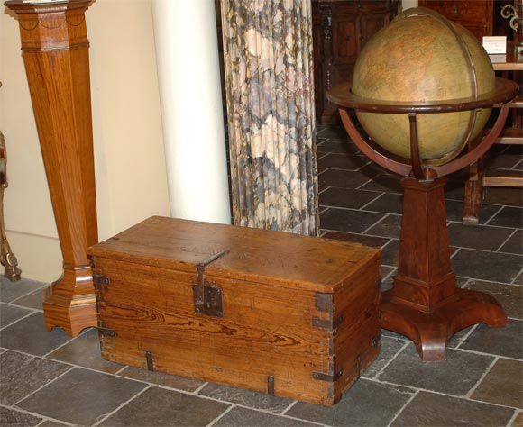 Spanish colonial pine blanket chest with hinged top.
