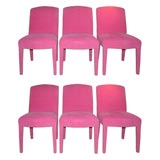 SIX DINING CHAIRS FULLY UPHOLSTERED IN HOT PINK CHENILLE FABRIC.