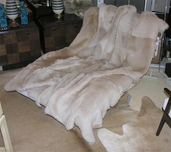 Very sexy cream color shearling throw with raw edges.