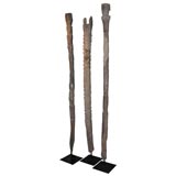 a set of three Nupe house poles mounted