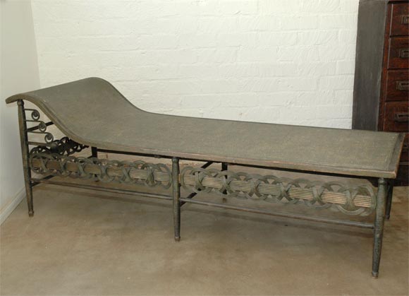 This american Heywood Wakefield chaise has a plyable cane surface supported in a wooden frame on six turned legs. The understructure has a variety of decorative elements that lend a degree of peacefulness to the whole. The celluloid Heywood