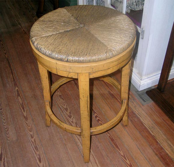 Barstool with swivel seat made of swamp rush. Distressed painted base with footrest. 28