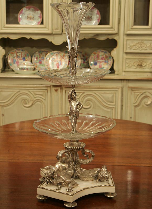 Magnificent silver plated bronze, crystal and marble epergne with dragons and cherubs. The quality of this is excellent. We thought it was 19th century when purchased but upon further looks it was probably made in the early part of the 20th century.