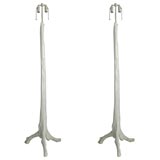 Pair of tree trunk shaped floor lamps .